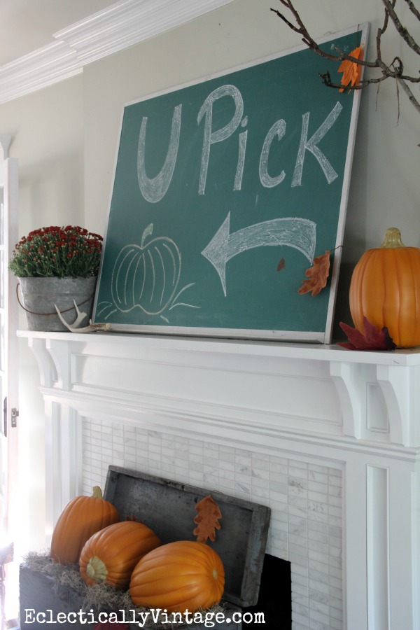 Love the chalkboard on this fun Fall mantel at eclecticallyvintage.com
